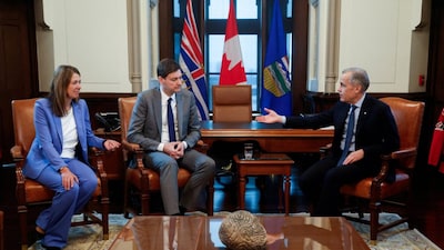 Canada's Prime Minister Mark Carney meets with British Columbia Premier David Eby and Alberta Premier Danielle Smith on Parliament Hill in Canada. (REUTERS)