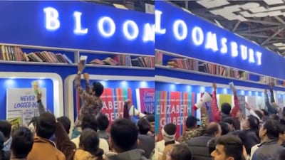 A man was captured standing above others to grab the books. (Photo Credit: X)