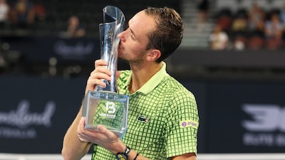 Daniil Medvedev holds the winner's trophy. (AP Photo)