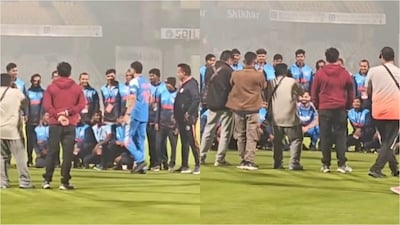 Kohli posing for a group picture with the BCA ground staff on Sunday (X)