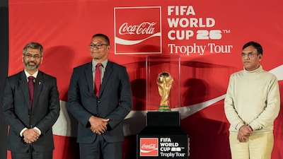 (From left) President of the AIFF) Kalyan Chaubey, Brazilian football legend Gilberto D'Silva and Union Sports Minister Mansukh Mandaviya during the unveiling of the original FIFA World Cup 2026 trophy. (PTI Photo)
