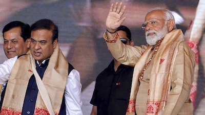 Prime Minister Narendra Modi during a public meeting, in Jorhat district. Assam Chief Minister Himanta Biswa Sarma is also seen. (IMAGE: PTI FILE) 