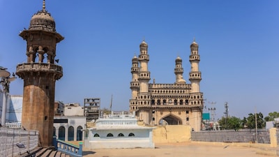 Hyderabad residents shield themselves from the blazing afternoon sun as temperatures soar past 33°C, marking an early arrival of summer-like heat.