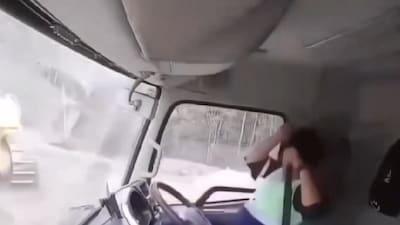 A video shows a driver unfastening his seat belt and escaping his truck just moments before a second landslide hits a nickel mining site in Indonesia. (IMAGE: X/@WeatherMonitors)