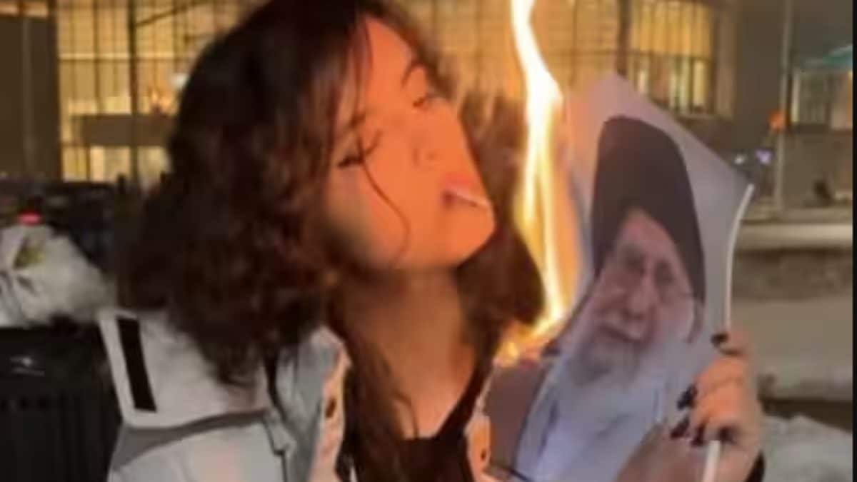 What's Behind Videos Of Iranian Women Using Khamenei’s Burning Picture To Light Cigarettes