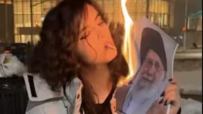 Iranian women ignite a new protest trend by burning images of Supreme Leader Ayatollah Khamenei.