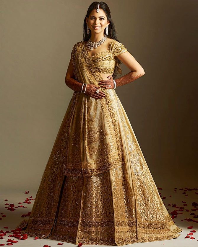 isha ambani dress designer Isha Ambani Piramal donning the beautifully designed Bandhani gown. Roberto Cavalli elegantly fused Indian craftsmanship with Italian couture to create this masterpiece. Styling assistants @ali.by.ali @gupta_eshaaa Styling & Creative direction
