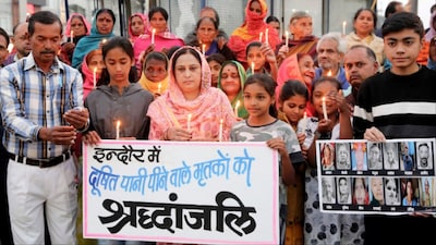 Bhopal: Congress workers and locals take out a candlelight vigil for the people who died due to water contamination in Indore (Photo: PTI)