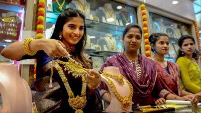 Women purchase gold ornaments from a jewellery store (File photo: PTI)
