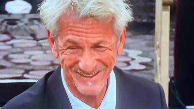 Sean Penn Shocks Everyone As He Smokes At His Table During Golden