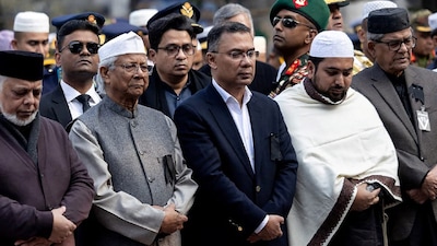 BNP's acting chairman Tarique Rahman (C) pictured standing alongside chief adviser of the country's interim government Muhammad Yunus (2L) during the burial ceremony of his mother and the nation's former prime minister Khaleda Zia a day after her death in Dhaka. (IMAGE: AFP) 