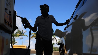 A customer pumps gas into their vehicle in Miami, Florida. (Getty Images via AFP)
