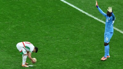 Senegal's goalkeeper Edouard Osoque Mendy, right, approaches Morocco's Brahim Abdelkader Díaz before he took a penalty during the Africa Cup of Nations final soccer match between Senegal and Morocco in Rabat, Morocco, Sunday, Jan. 18, 2026. (AP Photo/Youssef Loulidi)