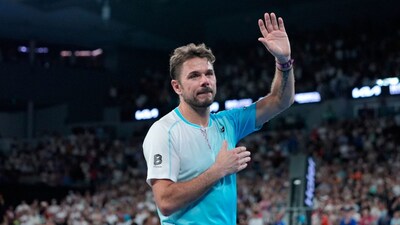 Stan Wawrinka of Switzerland waves as he leaves the court following his third round loss to Taylor Fritz of the U.S. at the Australian Open tennis championship in Melbourne, Australia, Saturday, Jan. 24, 2026. (AP Photo/Asanka Brendon Ratnayake)