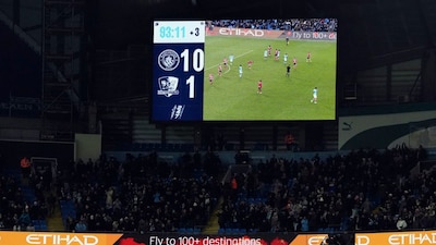 The scoreboard displays the 10-1 scoreline during the FA Cup third round match between Manchester City and Exeter in Manchester, England Saturday, Jan. 10, 2026. (Nick Potts/PA via AP)