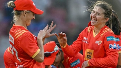 Georgia Wareham celebrates with her teammate Sophie Devine after taking the wicket of UP Warriorz's Harleen Deol (Picture credit: AFP)