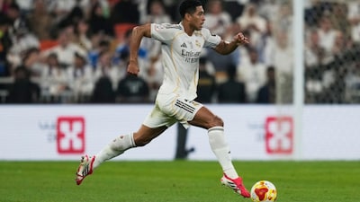 Jude Bellingham runs with the ball during the Spanish Super Cup final against Barcelona (Picture credit: AP)