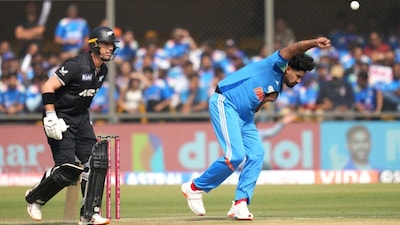 Harshit Rana bowls a delivery as New Zealand's Will Young, left, prepares to run (Picture credit: AP)