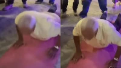 His wife watches silently from the side as he carries on. (Photo Credit: Instagram)