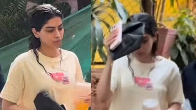 Khushi Kapoor covered her face with a purse. (Photo Credit: Instagram)