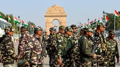 Security personnel conduct an area domination march along Kartavya Path near India Gate ahead of Republic Day celebrations, in New Delhi. (PTI)