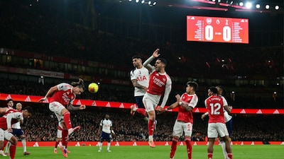 Riccardo Calafiori headers the ball to defend a shot during the English Premier League football match between Arsenal and Tottenham Hotspur (Picture credit: AFP)