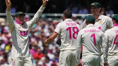 Marnus Labuschagne congratulates teammate Michael Neser after dismissing England's Zak Crawley (Picture credit: AP)