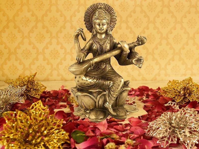 Helping Children Take Part in Saraswati Puja at Home Parents can help children take part by setting up a small Saraswati Puja space at home. A picture or idol of Goddess Saraswati is placed on a yellow cloth. Children can help arrange books, pencils, and musical instruments near the altar. Flowers and sweets are offered together as a family. This simple setup makes children feel involved and curious about prayer and learning in a gentle way.
