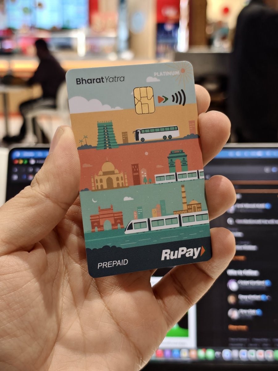 The Bharat Yatra Card operates under India’s Common Mobility Card (NCMC) framework. It aims to unify transit payments across the country. It is powered by RuPay and issued in partnership with Pine Labs. A key feature of the card is zero-KYC issuance, meaning users can buy and start using the card without completing detailed verification at the time of purchase. This removes the need to stand in queues and makes the onboarding process simple and immediate.
The Bharat Yatra Card operates under India’s Common Mobility Card (NCMC) framework. It aims to unify transit payments across the country. It is powered by RuPay and issued in partnership with Pine Labs. A key feature of the card is zero-KYC issuance, meaning users can buy and start using the card without completing detailed verification at the time of purchase. This removes the need to stand in queues and makes the onboarding process simple and immediate.