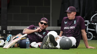England coach Brendon McCullum with Zak Crawley (AP)