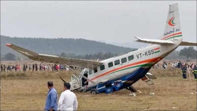  People gather at the site after a small aircraft carrying four passengers and two crew members crashed in Rourkela. (PTI)