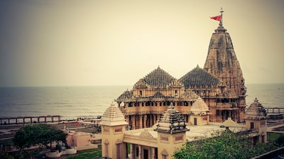 Perched on the shores of the Arabian Sea in Prabhas Patan, Gujarat, the Somnath Temple is one of Hinduism’s most sacred shrines. Known as the first of the twelve Jyotirlingas of Lord Shiva, it has been a site of pilgrimage for centuries. But Somnath’s story is not just spiritual; it is also historical, marked by repeated invasions, destruction, and reconstruction. Despite these adversities, Somnath has endured, earning the title of “Shrine Eternal.”