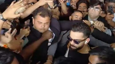 Virat Kohli flanked by fans in Vadodara. (Screengrab/ANI)