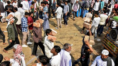 People carry bricks in view of former TMC MLA Humayun Kabir's plan to lay the foundation stone for a mosque, modelled on Ayodhya’s Babri Masjid, at Rejinagar in West Bengal’s Murshidabad district. (Image: PTI)