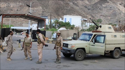 Soldiers gather outside the headquarters of the Southern Transitional Council in Aden, Yemen. (Reuters)