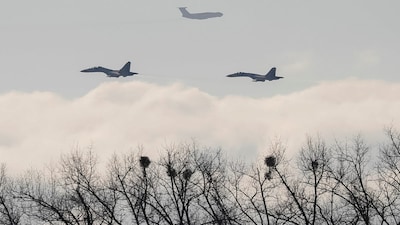 Ukrainian Su-27 fighter jets escort an IL-76. REUTERS/Gleb Garanich