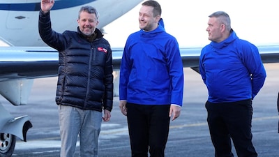 Denmark's King Frederik (L) is welcomed at Nuuk Airport by Greenlandic Prime Minister Jens-Frederik Nielsen and Speaker of the Greenlandic Parliament Kim Kielsen, in Nuuk. Ritzau Scanpix/Bo Amstrup via REUTERS    