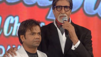 Rajpal Yadav and Amitabh Bachchan at an event.