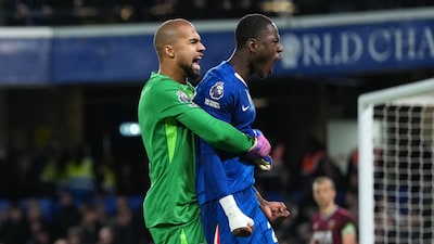 Chelsea's goalkeeper Robert Sanchez and Trevoh Chalobah, right, celebrate at the the end of the English Premier League soccer match between Chelsea and West Ham United in London, Saturday, Jan. 31, 2026. (AP Photo/Alastair Grant)
