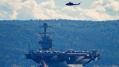 The world's largest warship, US aircraft carrier USS Gerald R. Ford, on its way out of the Oslofjord at Nesodden and Bygdoy, Norway. (IMAGE: REUTERS)