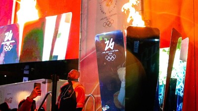 Flame arrives in Milan for Winter Olympics ceremony