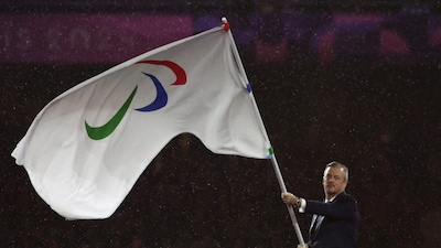 President of the International Paralympic Committee (IPC) Andrew Parsons waves the Paralympics flag (AFP)