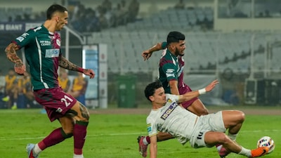 Martin Quintano defends against Mohun Bagan's Alberto Rodriguez and Mehtab Singh during an Indian Super League (ISL) football match between Mohun Bagan Super Giant and Chennaiyin FC, at Salt Lake Stadium, in Kolkata, Monday, Feb. 23, 2026. (PTI)