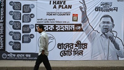 A man walks past a campaign poster of Bangladesh Nationalist Party (BNP) chairman and election candidate Tarique Rahman (Photo: AFP)