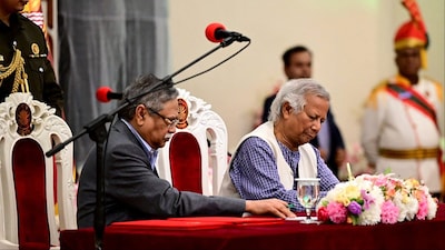 Muhammad Yunus (R) with President Mohammed Shahabuddin in Dhaka, Bangladesh (Photo: AFP)
