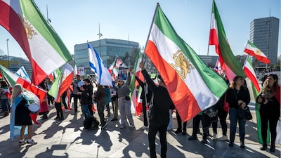 Protestors hold portraits of Reza Pahlavi during a demonstration organised by members of the Iranian diaspora outside the United Nations offices (Photo: AFP)