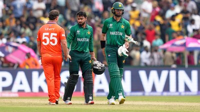 Netherlands' Michael Levitt, left, shakes hands with Pakistan's Faheem Ashraf as he leaves with teammate Shaheen Shah Afridi after Pakistan won their T20 World Cup cricket match against Netherlands in Colombo, Sri Lanka, Saturday, Feb. 7, 2026.(AP Photo)