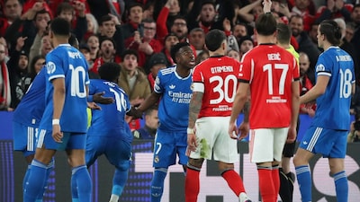 Real Madrid's Vinicius Jr protesting to the referee after being subjected to allegedly racist comments from Benfica's Prestianni (AFP)