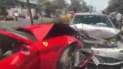 A light mast in the center of the road was also struck by the car, causing it to topple to one side.