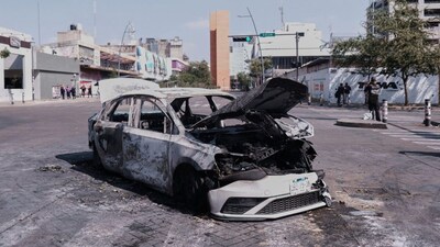 A vehicle sits charred after being set on fire, on a road in Guadalajara, Jalisco state, Mexico, Sunday, Feb. 22, 2026, after the death of the leader of the Jalisco New Generation Cartel, Nemesio Rubén Oseguera Cervantes, known as"El Mencho." (AP)